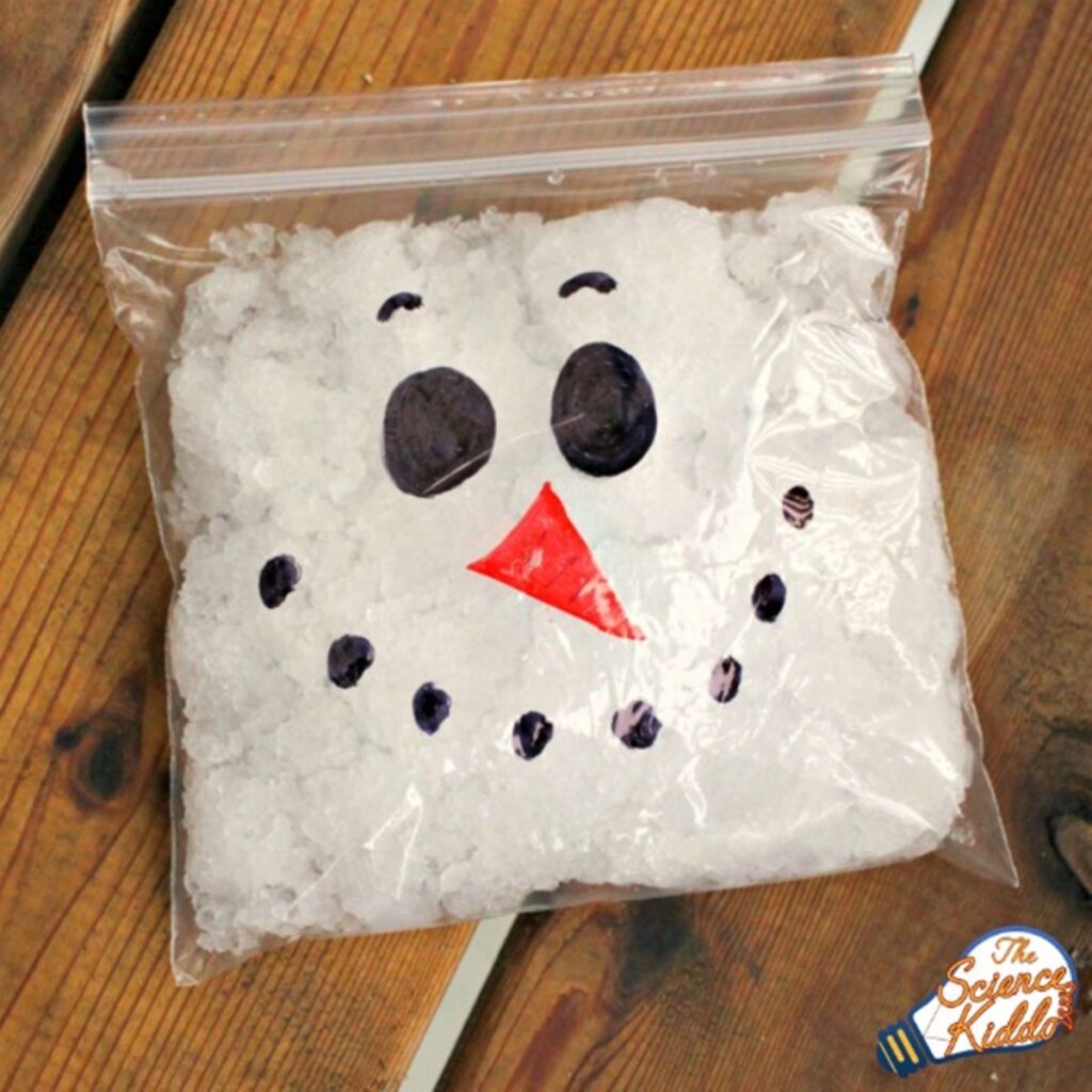 Ziploc bag full of snow with hand-drawn snowman face