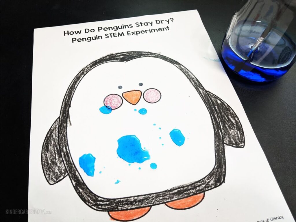 Water droplets form on a crayon-resist colored penguin